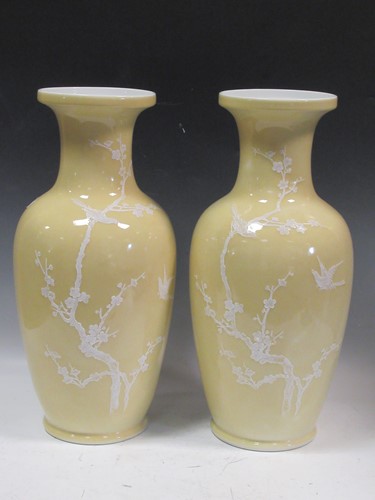Lot 103 - A pair of yellow and white chinese vases...