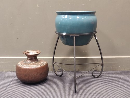 Lot 184 - A blue ceramic jardinere on wrought iron stand...
