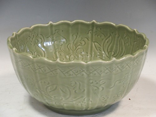 Lot 161 - A Chinese celedon green glazed bowl decorated...