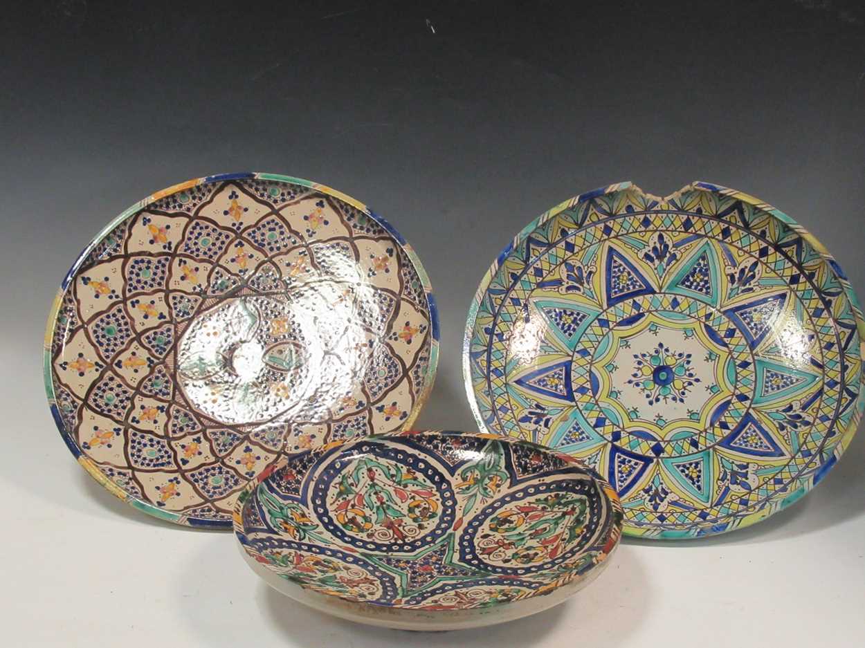Lot 36 - Three Moroccan plates, each decorated with...