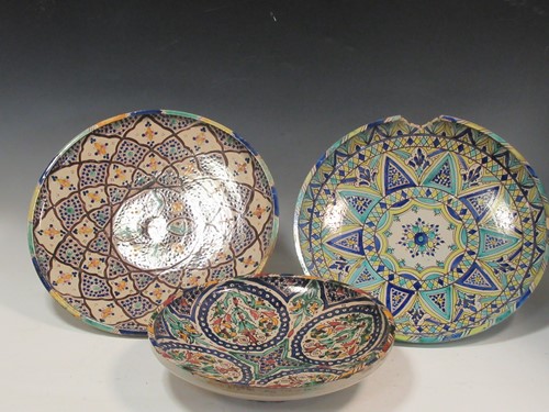 Lot 36 - Three Moroccan plates, each decorated with...