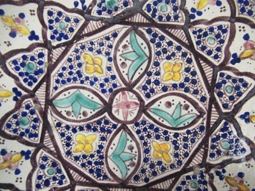 Lot 36 - Three Moroccan plates, each decorated with...