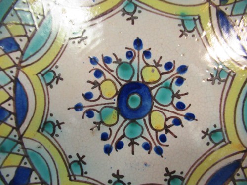 Lot 36 - Three Moroccan plates, each decorated with...
