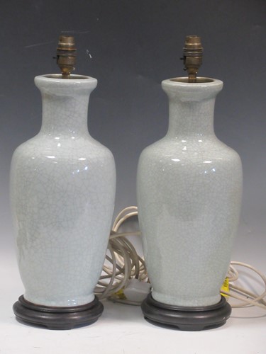 Lot 52 - A pair of light blue crackle glazed ceramic...