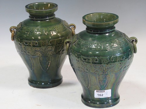 Lot 162 - Pair of two handled green glazed vases...
