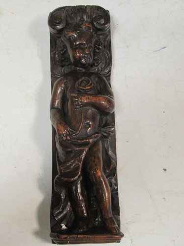Lot 163 - A carved walnut mount of a putto, probably...