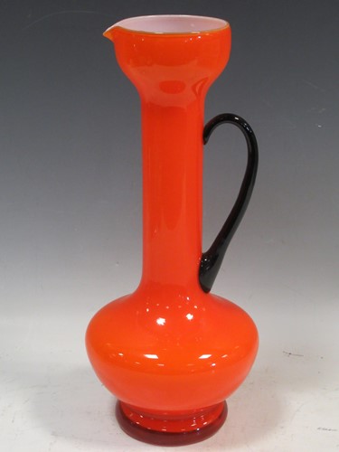 Lot 47 - A 1960s orange glass jug with balck glass...