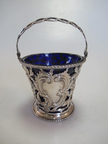 Lot 277 - Pierced silver cream pail with blue glass liner