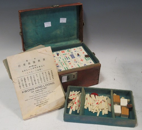 Lot 144 - A vintage leather cased Chinese Mahjong set