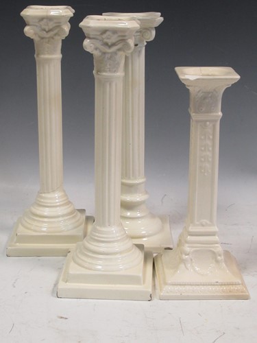 Lot 67 - A pair of creamware columnar candlesticks and...