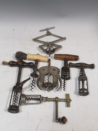 Lot 74 - A collection of corkscrews to include examples...