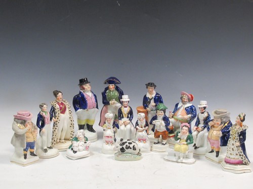 Lot 90 - A collection of Staffordshire figures to...