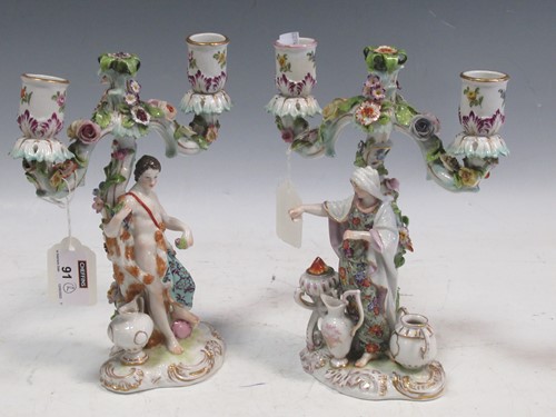 Lot 91 - A pair of German porcelain two-branch figural...