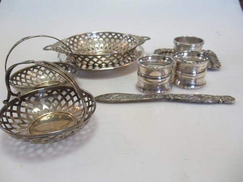 Lot 267 - 3 silver napkin rings, a pair of silver bon...