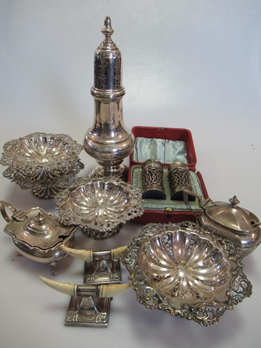 Lot 271 - A set of four silver bon bon dishes together...