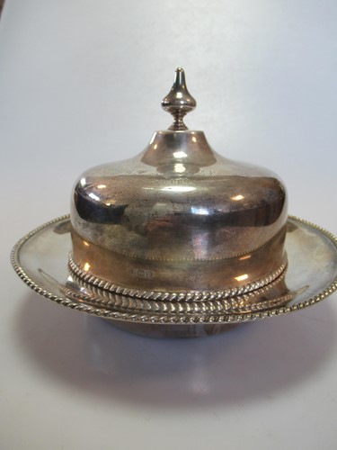 Lot 259 - A silver muffineer and cover with personal...