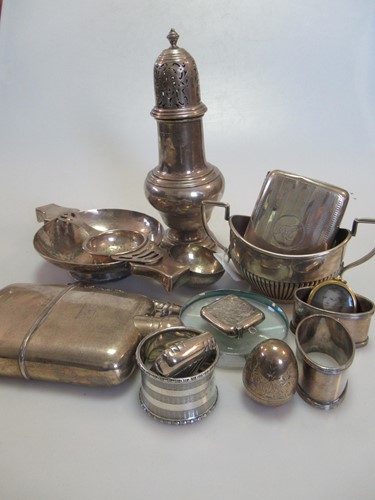 Lot 270 - A collection of silverware including napkin...