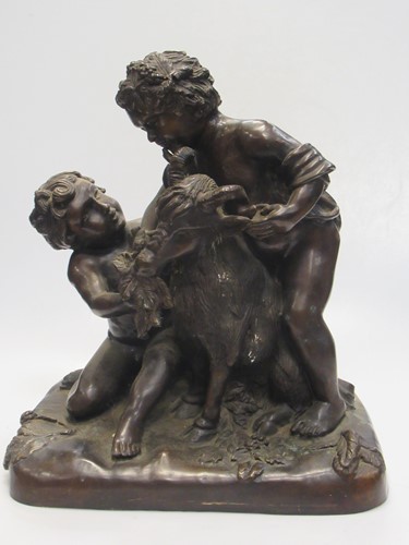 Lot 201 - A bronze figure group of two children feeding...