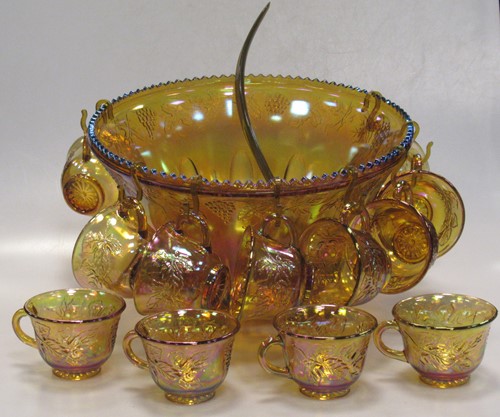 Lot 211 - An iridescent carnival glass punch bowl and...
