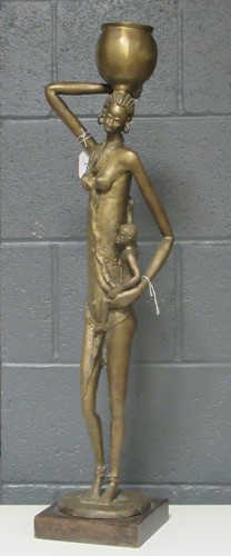 Lot 212 - A large metal figure of an African lady...