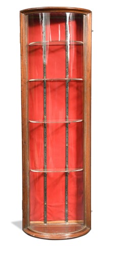 Lot 657 - A bow fronted mahogany glazed jeweller's cabinet, circa 1900