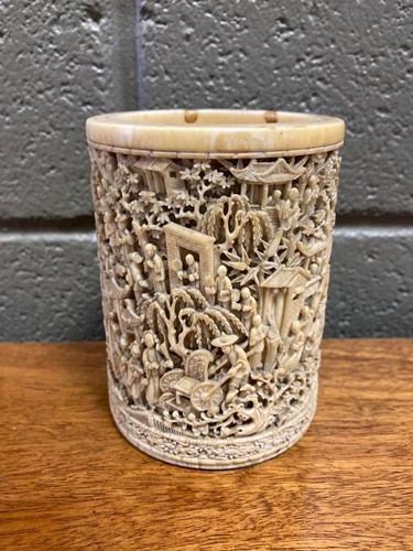 Lot 220 - An ivory brush pot with intricate carved...