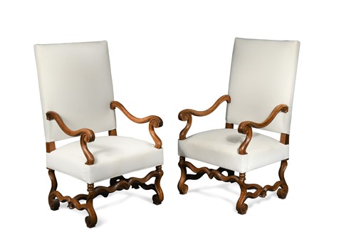 Lot 600 - A pair of French Louis XIV style walnut open arm chairs