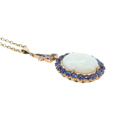 Lot 33 - An opal and sapphire cluster pendant and chain