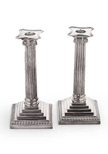 Lot 655 - A pair of George V silver candlesticks