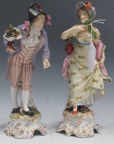 Lot 1 - A pair of Dresden type porcelain figures of a...