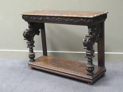 Lot 375 - A Victorian carved oak console table with...