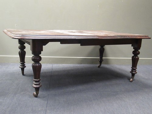 Lot 409 - A Victorian mahogany dining table, the rounded...