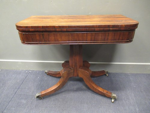 Lot 374 - A Regency rosewood card table on splayed legs,...