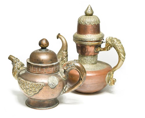 Lot 55 - A Tibetan copper and brass mounted butter teapot, 19th century