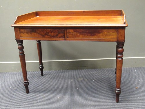 Lot 333 - A 19th century mahogany writing desk with...