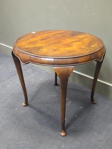 Lot 302 - A walnut circular occasional table, with...