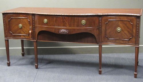 Lot 280 - A 19th century mahogany serpentine sideboard,...