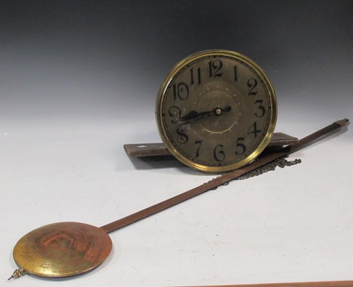 Lot 138 - A 1930's oak chiming longcase clock, circular,...