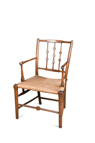 Lot 141 - In the manner of Morris & Co., an elm elbow chair