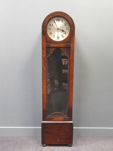Lot 140 - An Art-Deco longcase clock with a silvered...