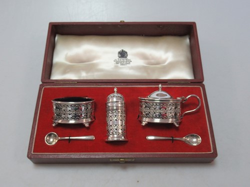 Lot 175 - A silver cruet set cased by Asprey, each main...