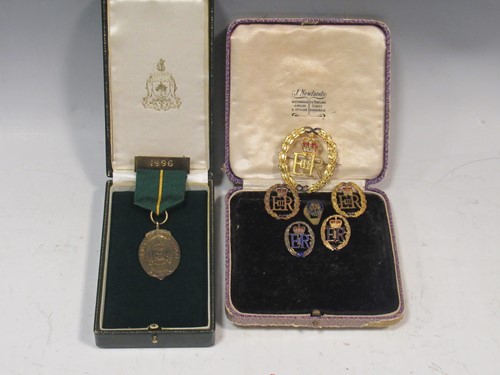 Lot 194 - A collection of five lapel badges as issued to...
