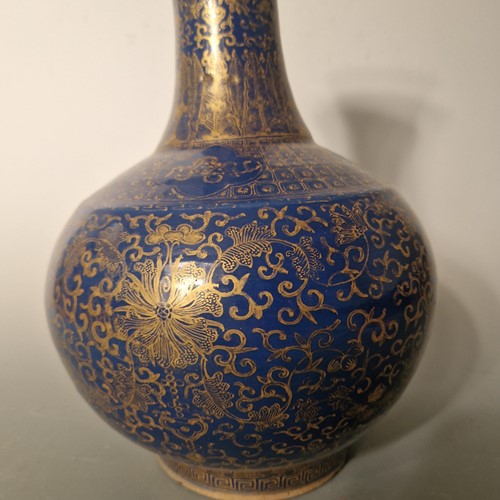 Lot 52 - A Chinese blue monochrome and gilt bottle vase, Qing Dynasty, 19th century
