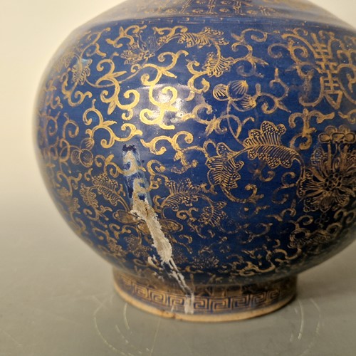 Lot 52 - A Chinese blue monochrome and gilt bottle vase, Qing Dynasty, 19th century