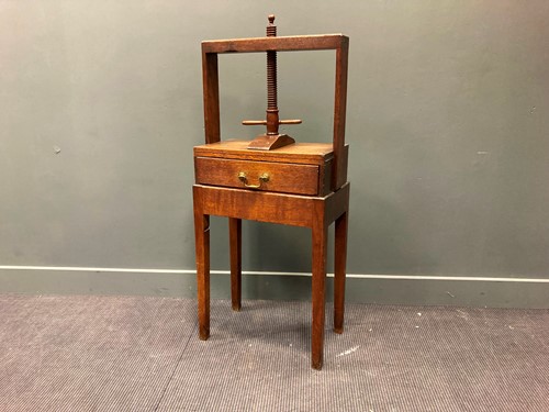 Lot 420 - A George III oak linen-press topped table with...