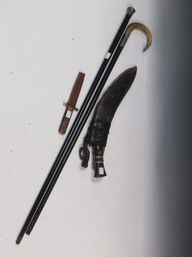 Lot 92 - A silver mounted walking stick & cane; khukri...