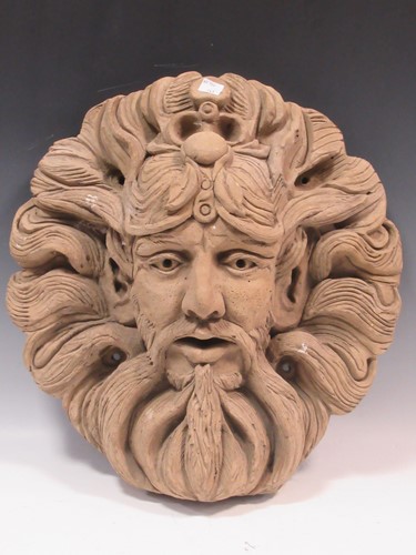 Lot 103 - A circular ceramic-modelled male head, 48 x 42...