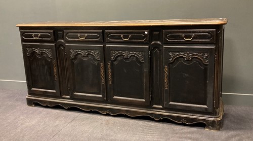 Lot 436 - A French black-painted carved wood dresser...