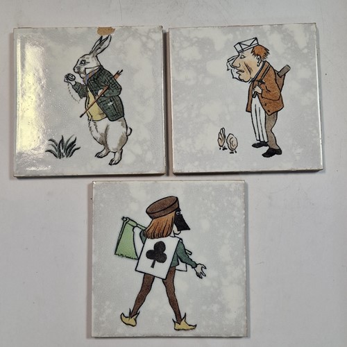 Lot 30 - Minton, after Charles Francis Annesley Voysey, a set of seven Alice in Wonderland tiles