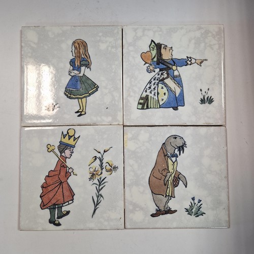 Lot 30 - Minton, after Charles Francis Annesley Voysey, a set of seven Alice in Wonderland tiles